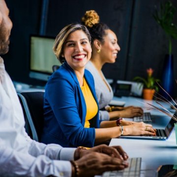 People sitting at a row of desks